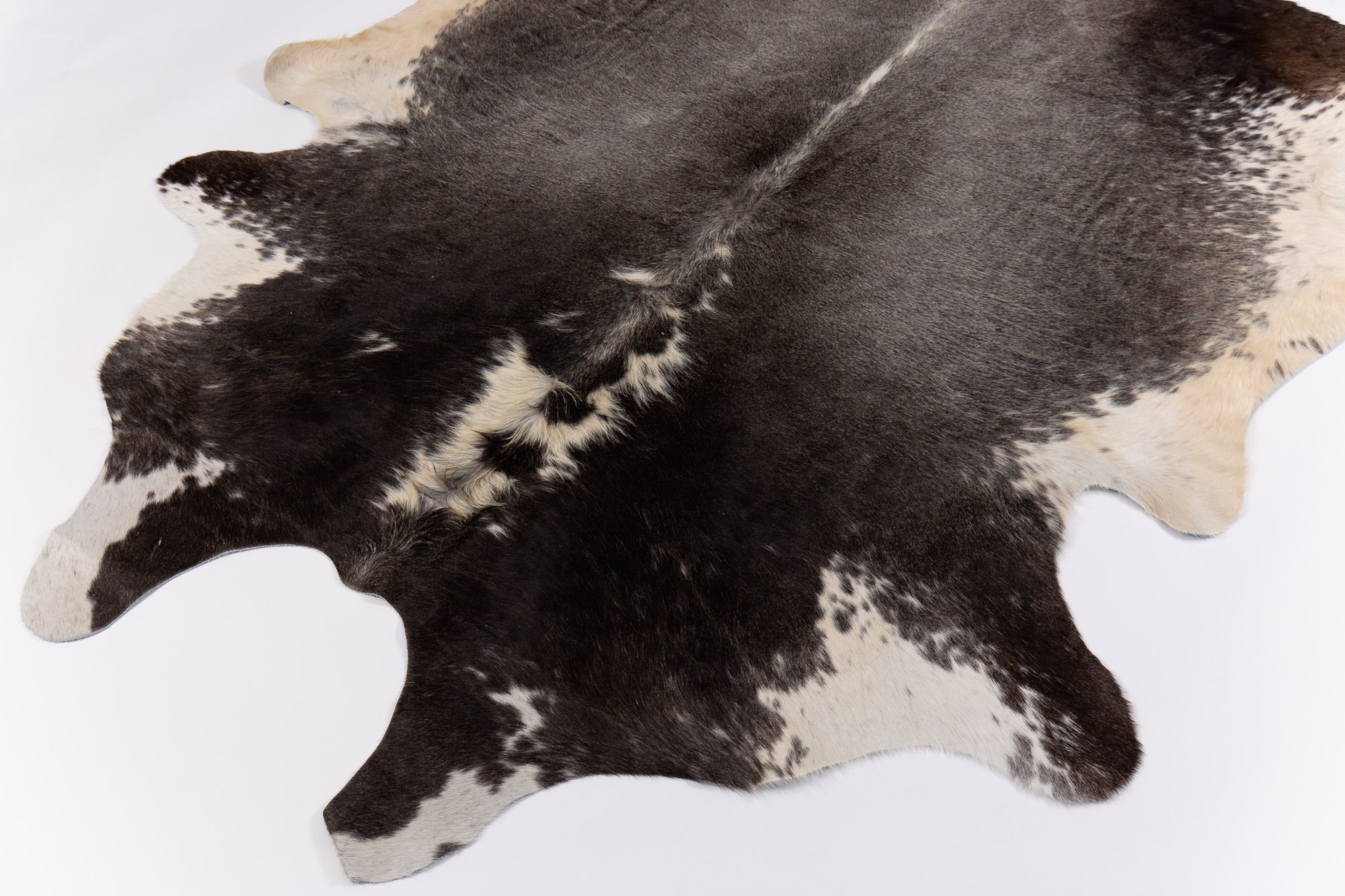 Is Your 'Real Cowhide Rug' a Fake? Here's the Difference Between Real & Faux