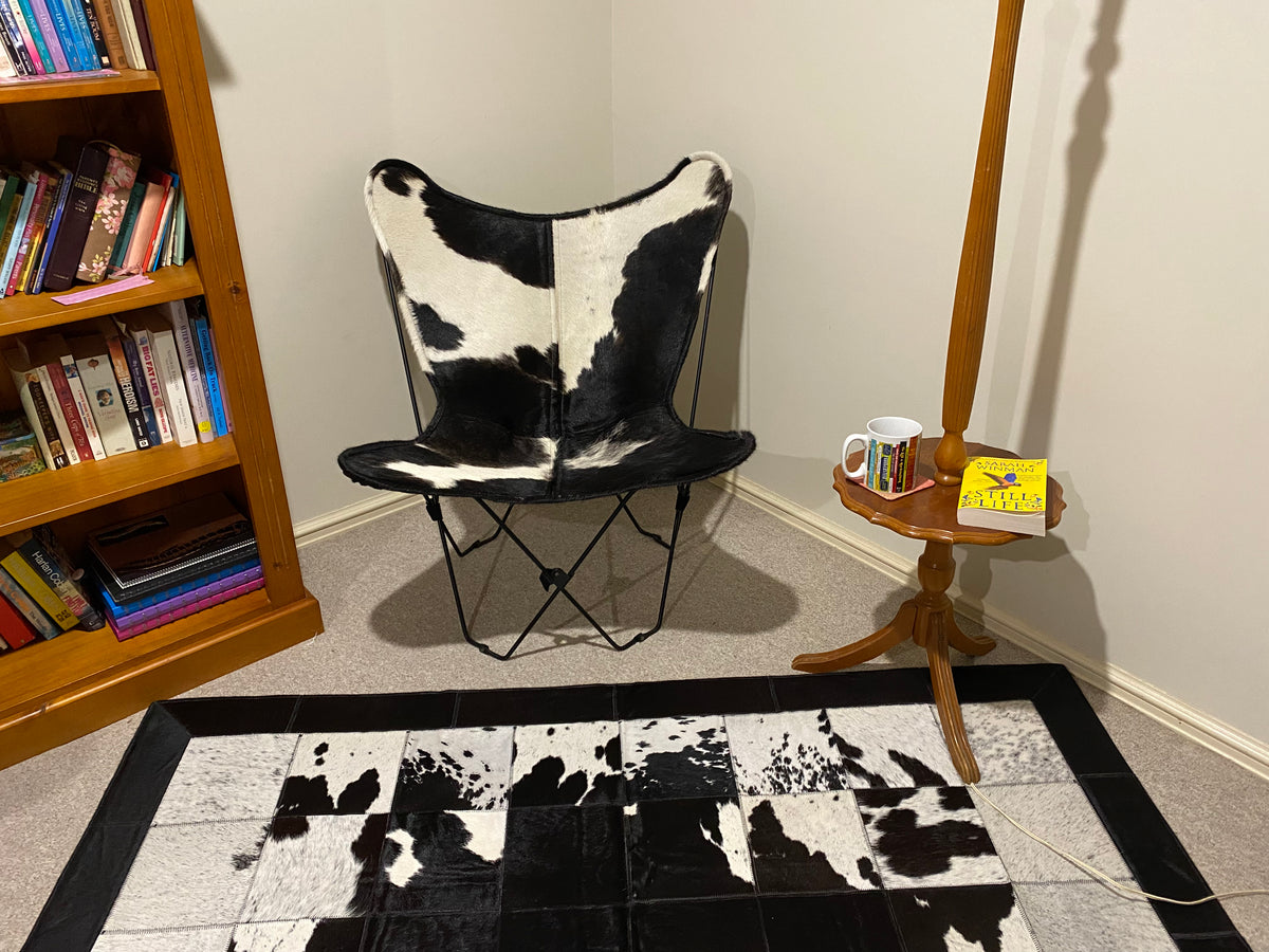 WHITE + BLACK COWHIDE BUTTERFLY CHAIR