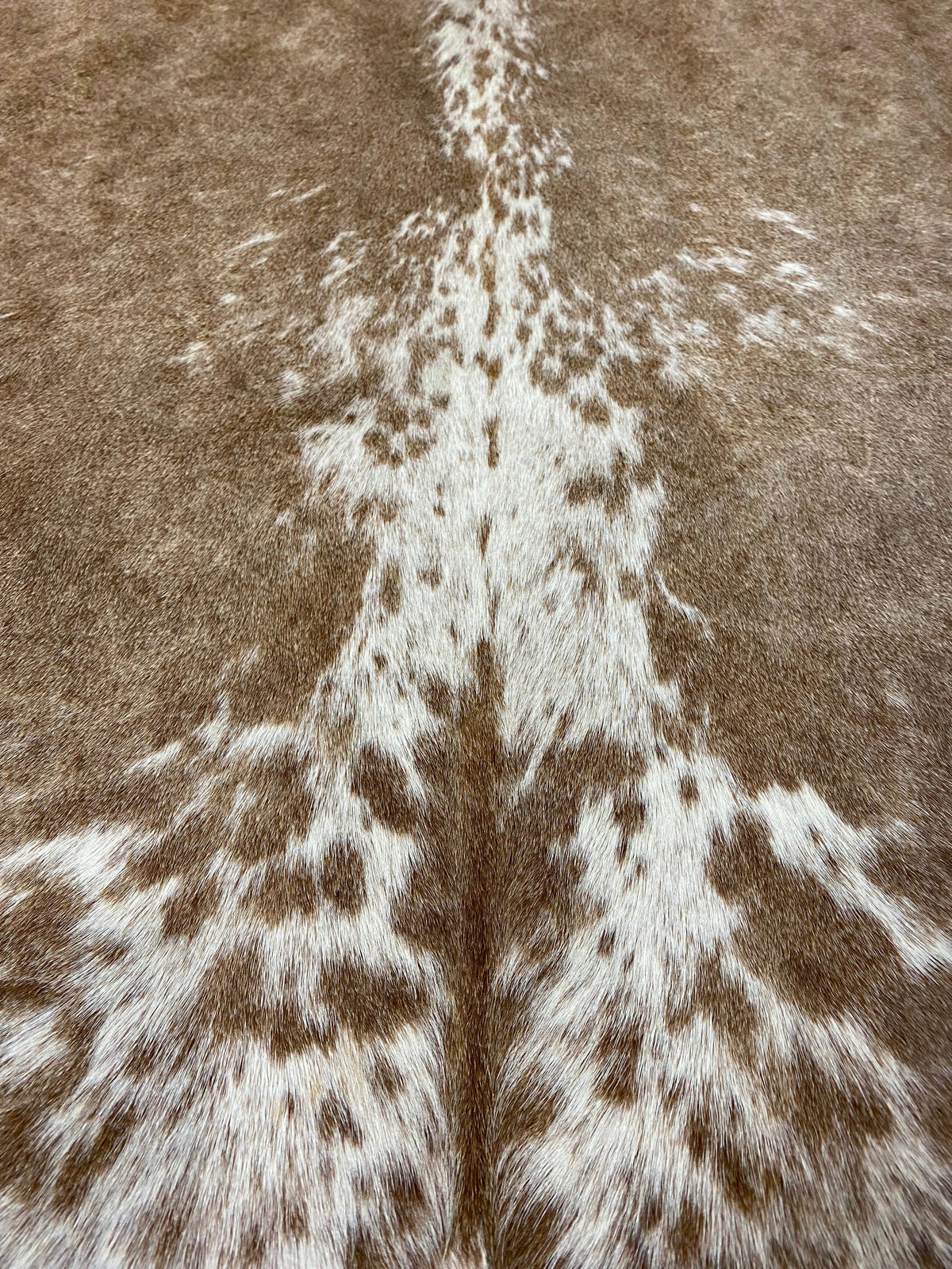 Isaac - Brown + white marble cowhide close up