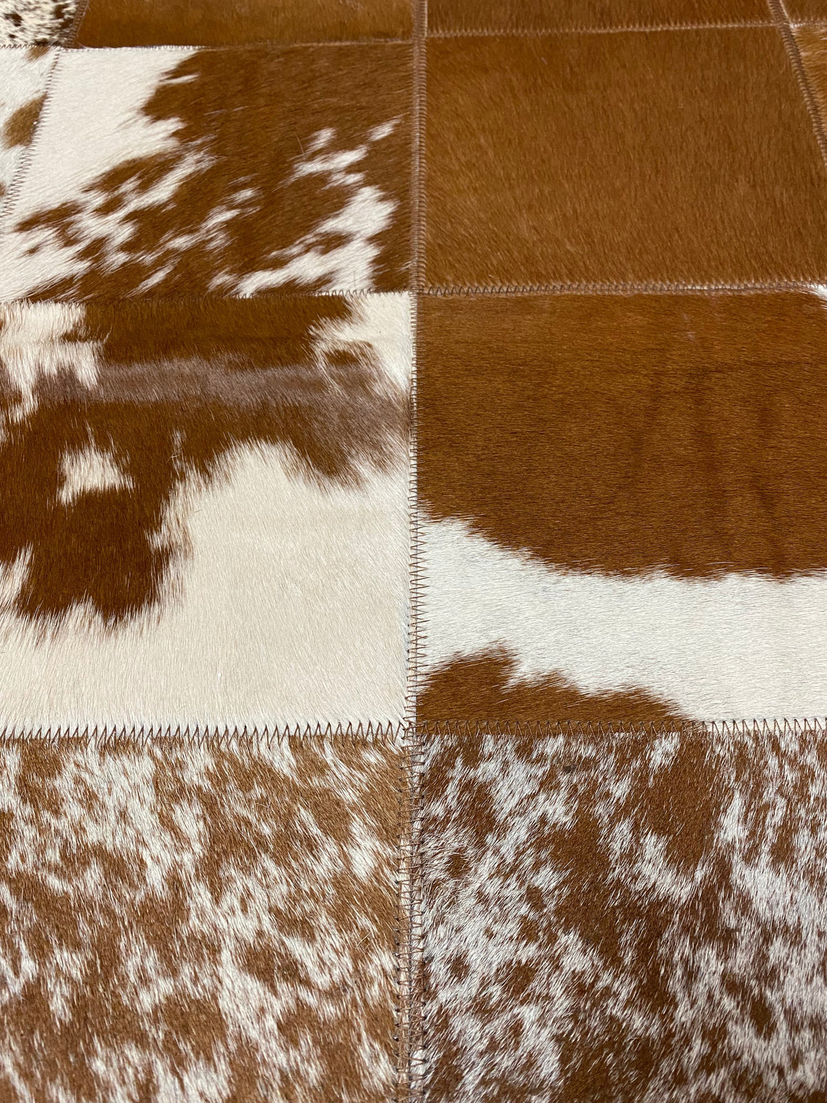 Brown &amp; White Patchwork rug close up