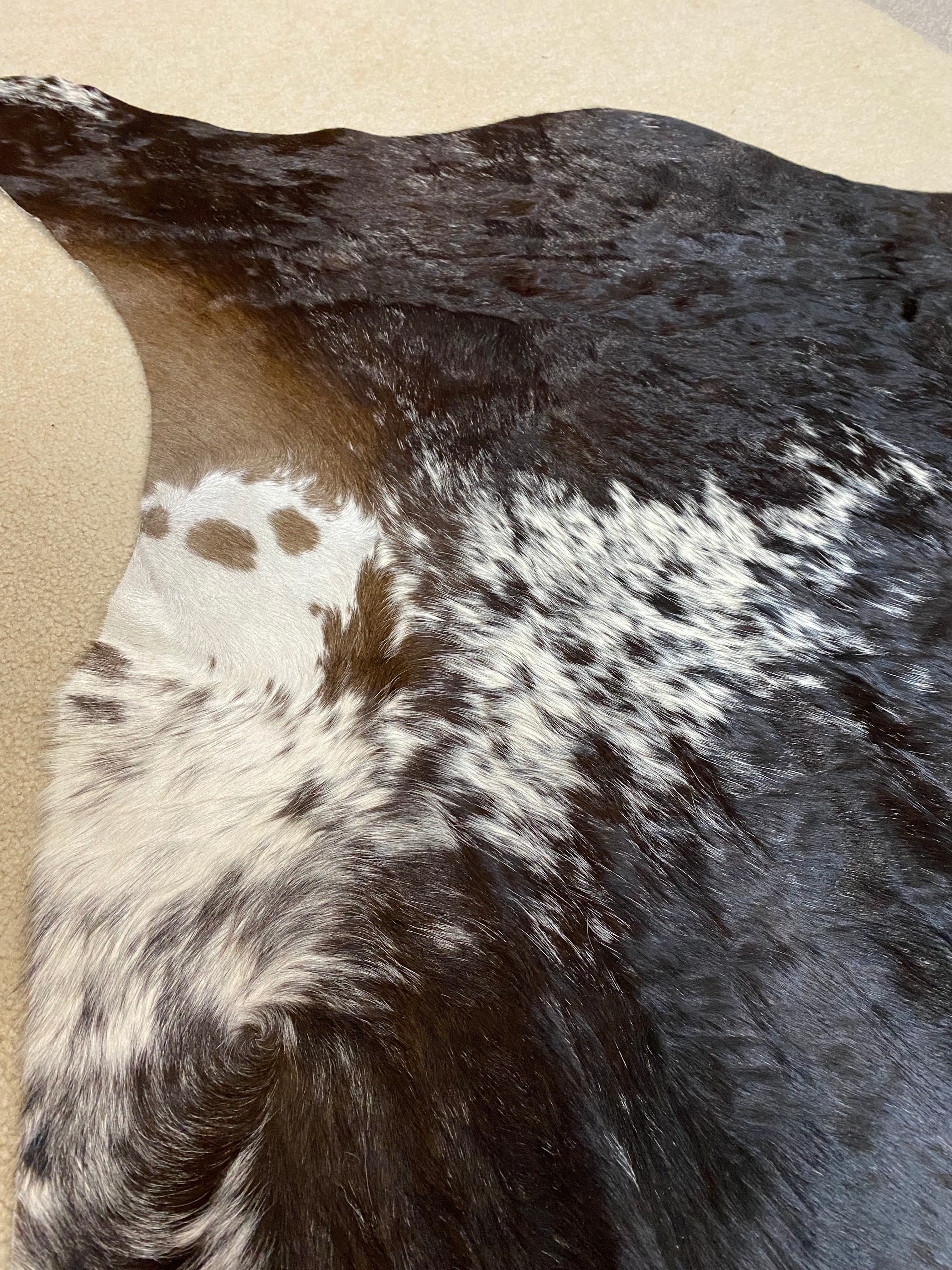 Tate - Brown + White speckle cowhide close up